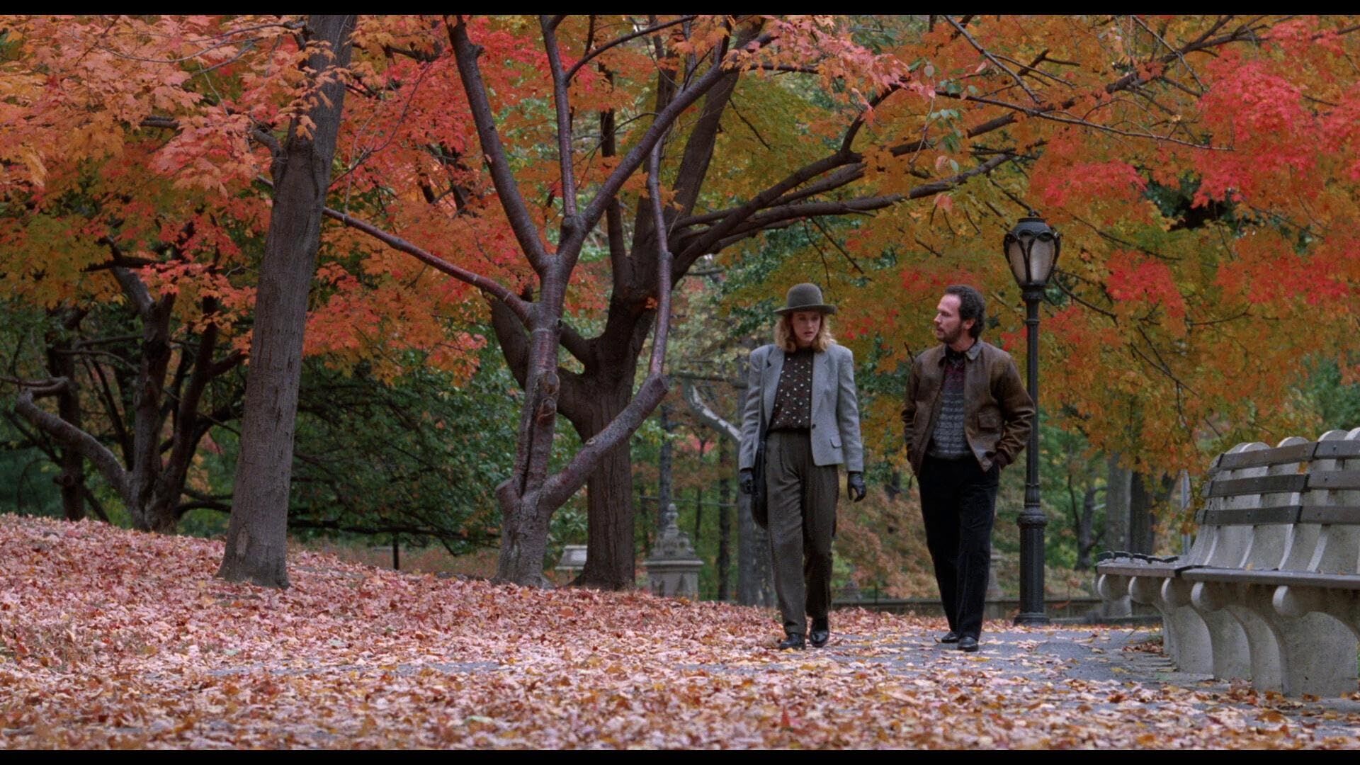 Meg Ryan and Billy Crystal walking through an autumn park