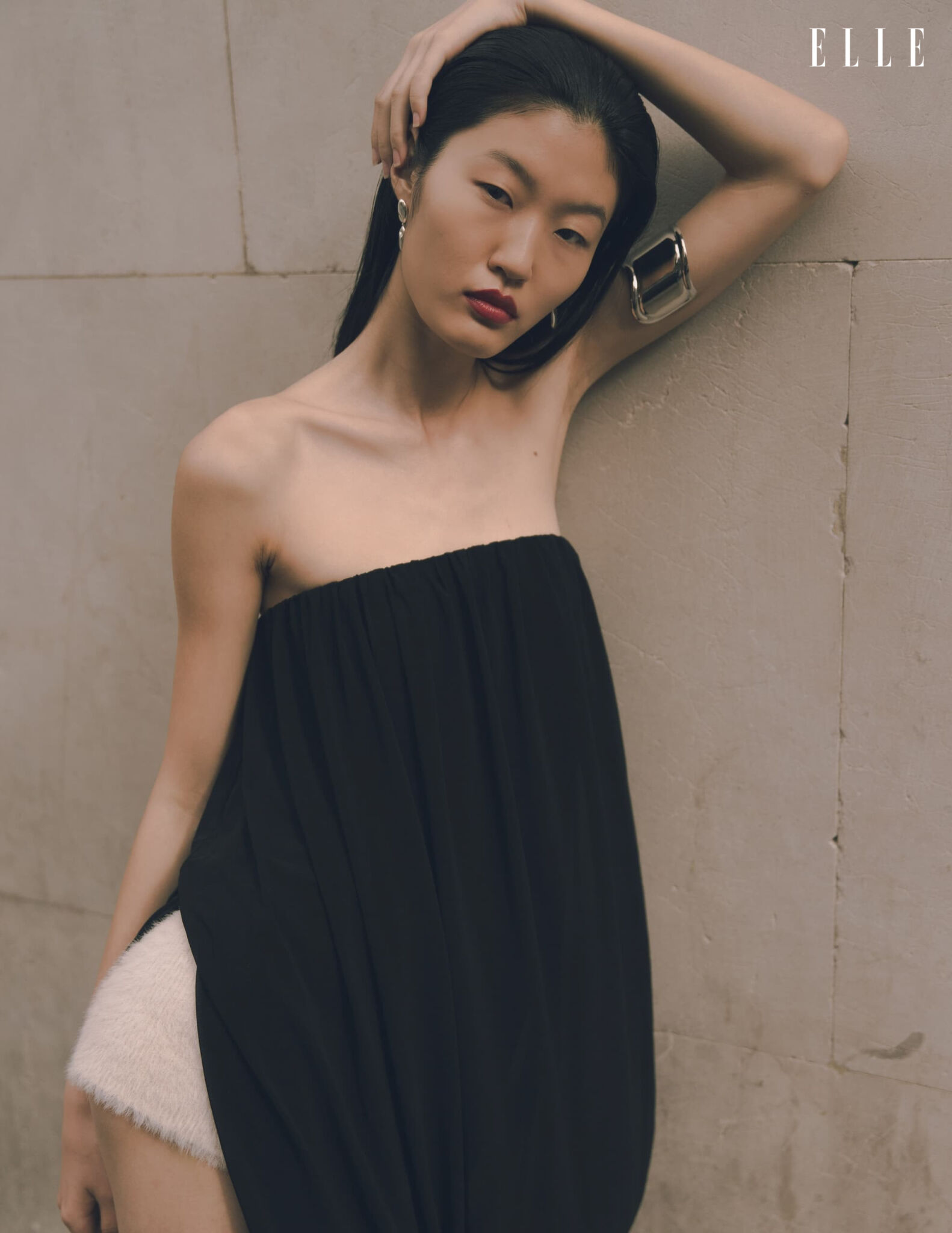 Portrait of Qian Wen Wu in a black top with a wide bracelet