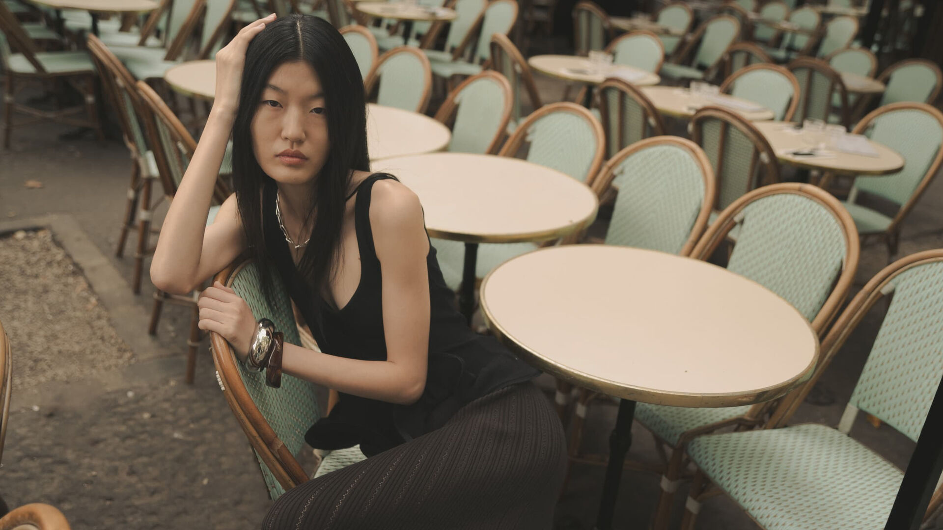 Qian Wen Wu at a Paris café, photographed by Kevin Schmalbach