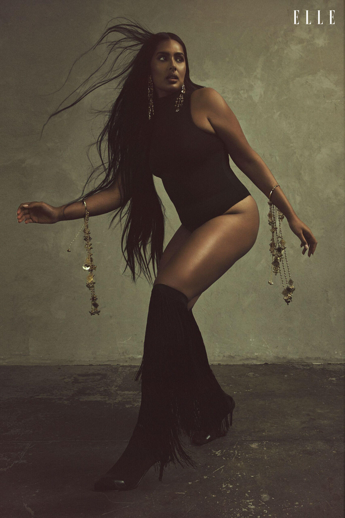 Shanaya Peters in a black bodysuit, fringed socks and cascading jewellery.