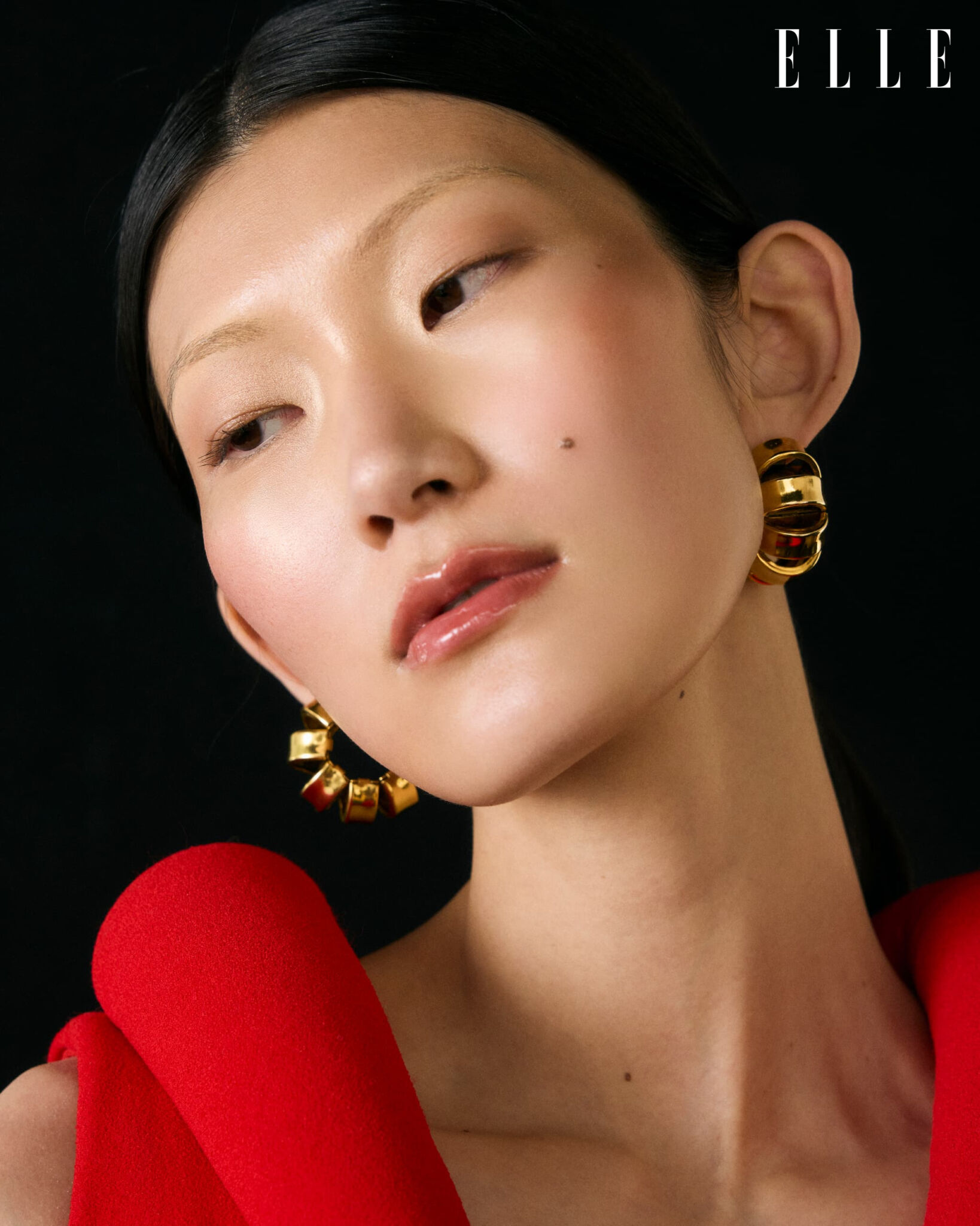 Close-up of Cheng Peng wearing a red Bottega Veneta dress.