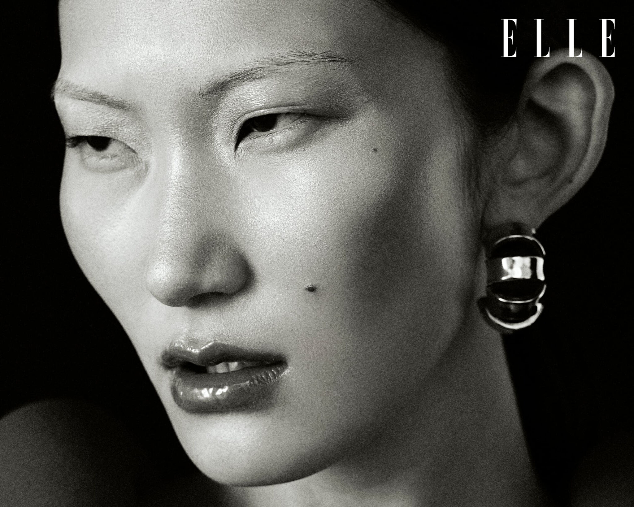 Black-and-white portrait of Cheng Peng wearing a Bottega Veneta top.