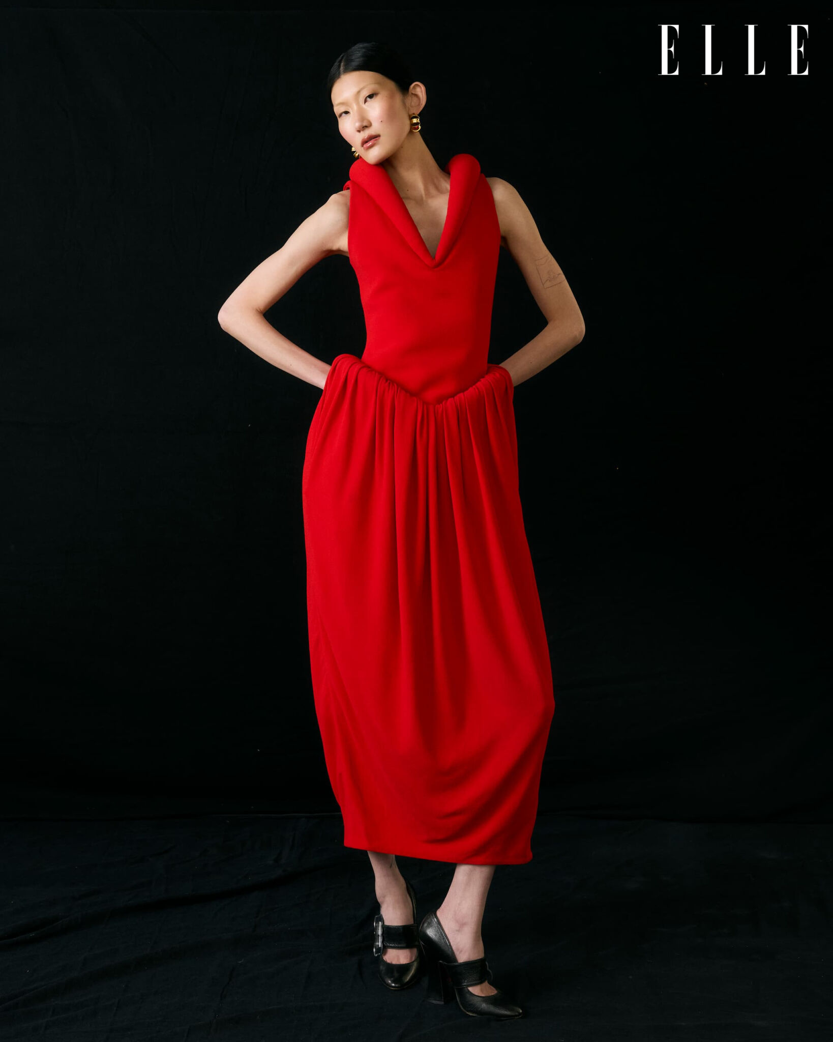 Cheng Peng in a red Bottega Veneta dress and Vivienne Westwood shoes.