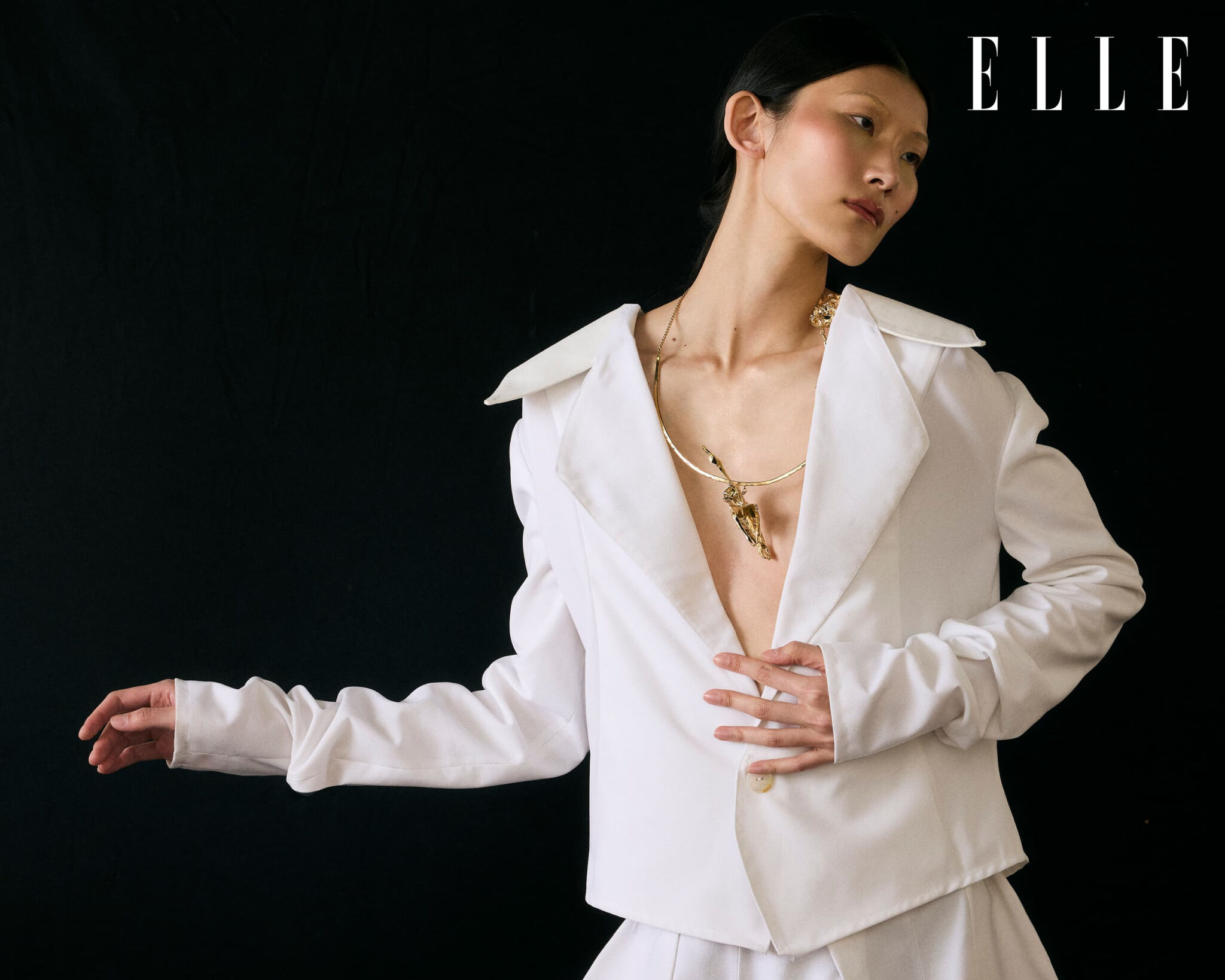 Cheng Peng in a white Atede top with a Valentino necklace.