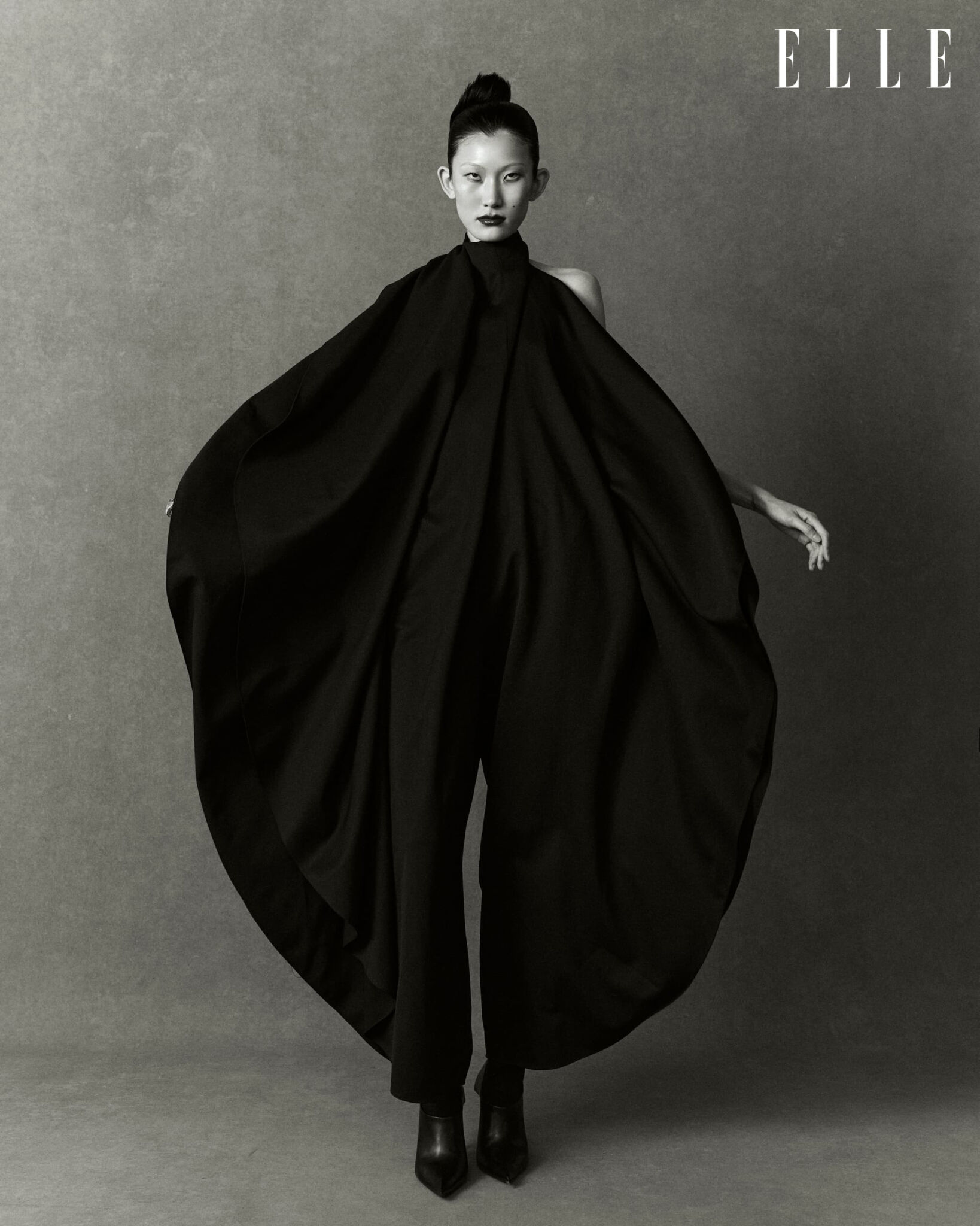 Cheng Peng in a black Alaïa jumpsuit and Balenciaga shoes.
