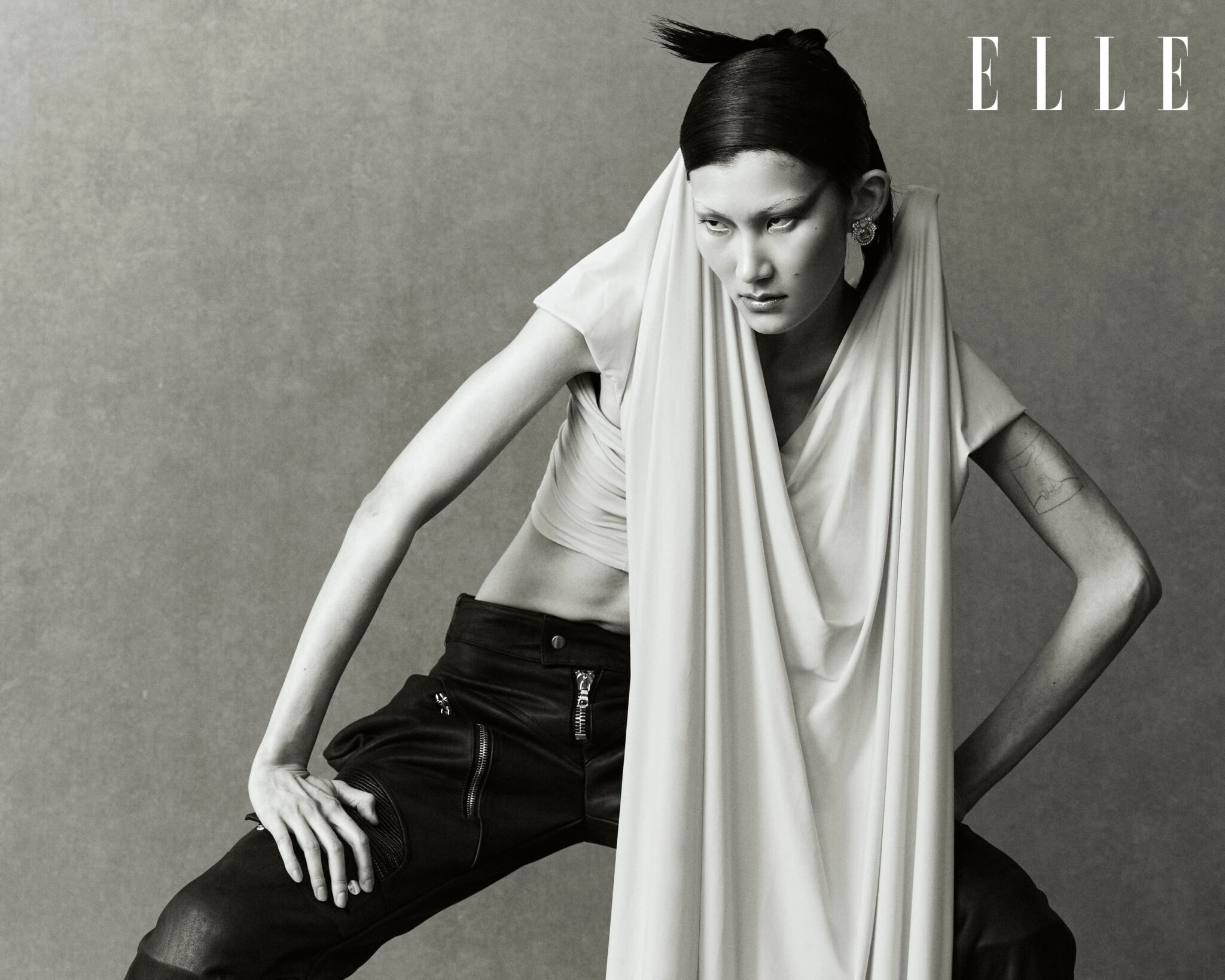 Cheng Peng wearing a Tiger Pengg dress in a black-and-white photograph.